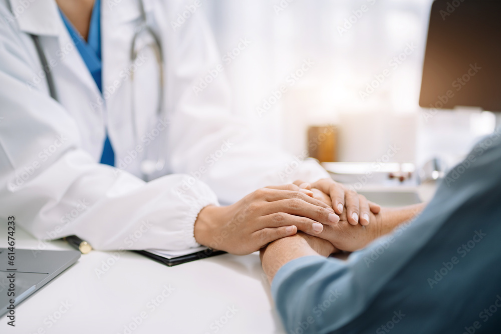 Doctor's hand reassuring elderly patient. Doctor's hand reassuring elderly patient.