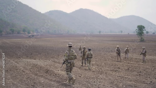 Team of U.S. Army marine corps soldier military war with gun weapon participating and preparing to attack the enemy in Thailand during exercise Cobra Gold training in battle. Combat force.