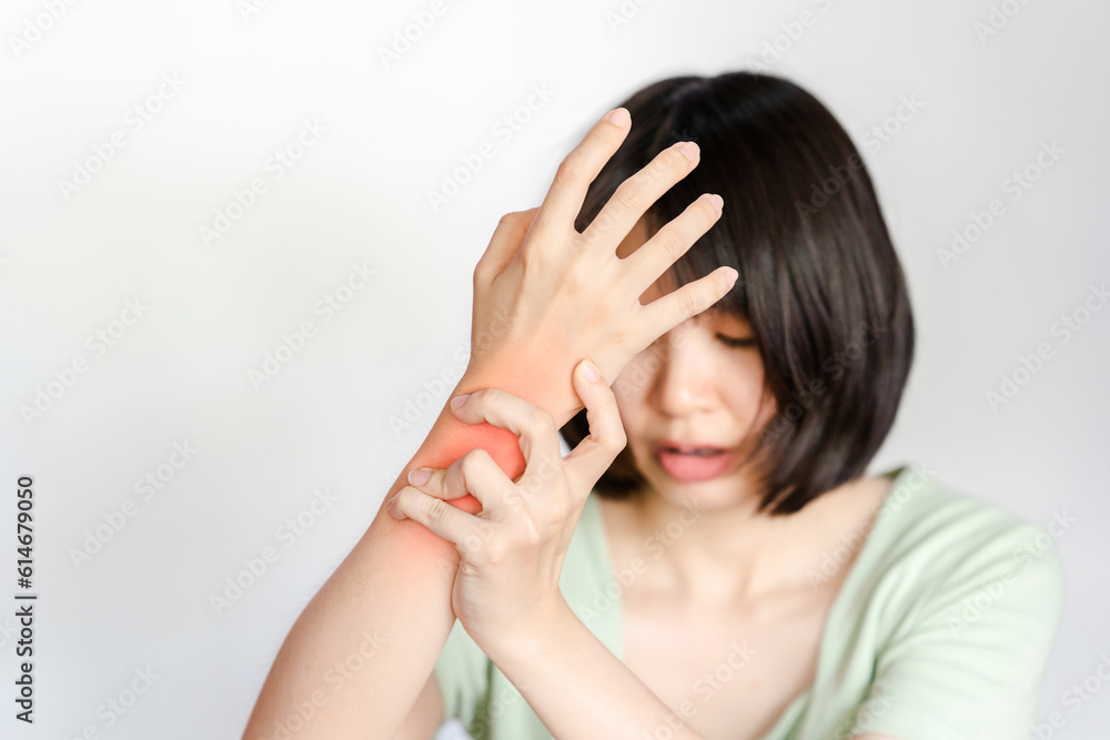 Woman's wrist with inflammation and pain showing red area. Health care concept. Woman's wrist with inflammation and pain showing red area. Health care concept.