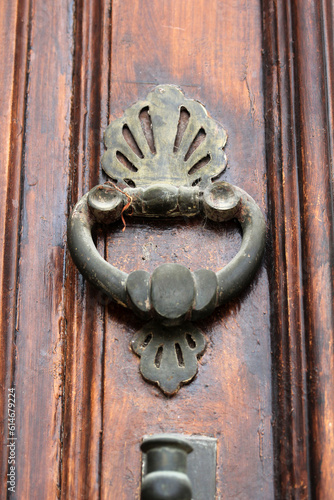 Wooden door of a traditional Konya house in Aziziye District. Metal doorknob. photo