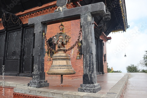 Kathmandu, Bagmati Nepal- June 9 2023: Large temple bell made up of golden bronze metal is placed in the historic Hindu mandir of Nepal dedicated to lord Shiva.