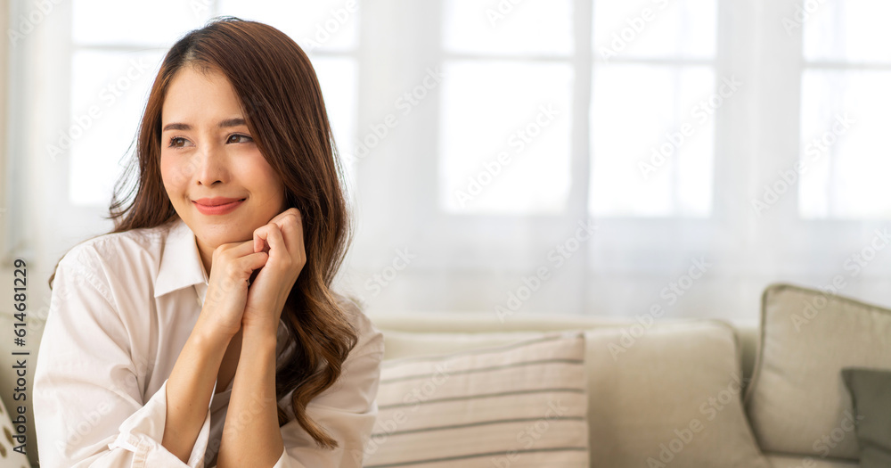 Portrait of smiling cheerful beautiful pretty asian woman clean fresh healthy white skin posing smile in pajamas white clothes.Girl felling relax and enjoy time on sofa at home.asia beauty Portrait of smiling cheerful beautiful pretty asian woman clean fresh healthy white skin posing smile in pajamas white clothes.Girl felling relax and enjoy time on sofa at home.asia beauty