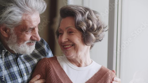 Loving elderly couple. Elderly husband and wife hugging and bonding with real emotions