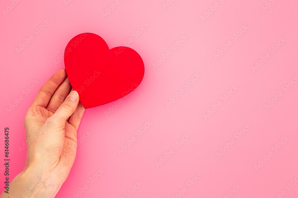 Medical and health care concept - heart with female hands Medical and health care concept - heart with female hands