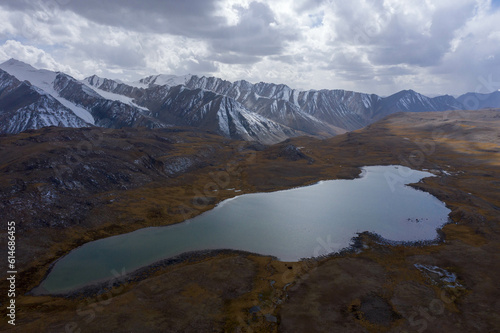  photo of the high-mountain lake Ak-Kul in Kyrgyzstan, Kyrgyzstan. Beauty from a bird's-eye view, drone.
