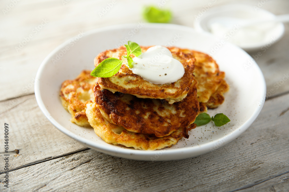 Traditional homemade latkes with sour cream Traditional homemade latkes with sour cream