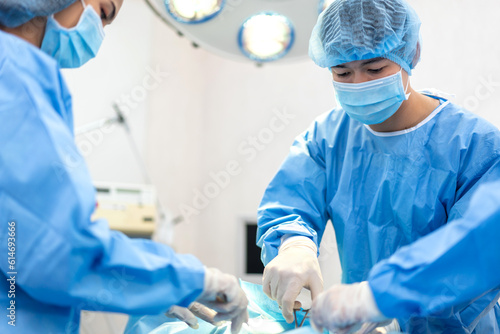 Professional anesthesiologist doctor medical team preparing patient to gynecological surgery operating with surgery equipment, save life, pain, surgical, hurt in hospital operation emergency room