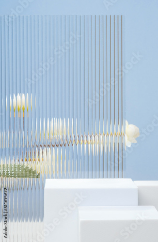 White block pedestal product display blue background with modern Transparency strip glass  and flower with sunshine light