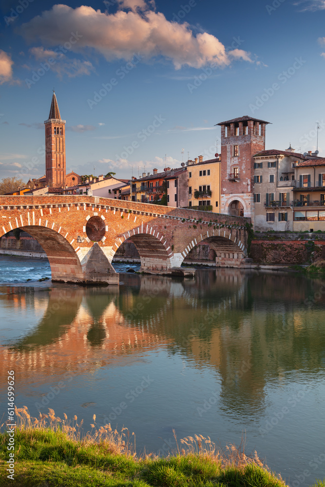 Verona, Italy. Cityscape image of beautiful Italian town Verona with the Stone Bridge over Adige River at sunset.