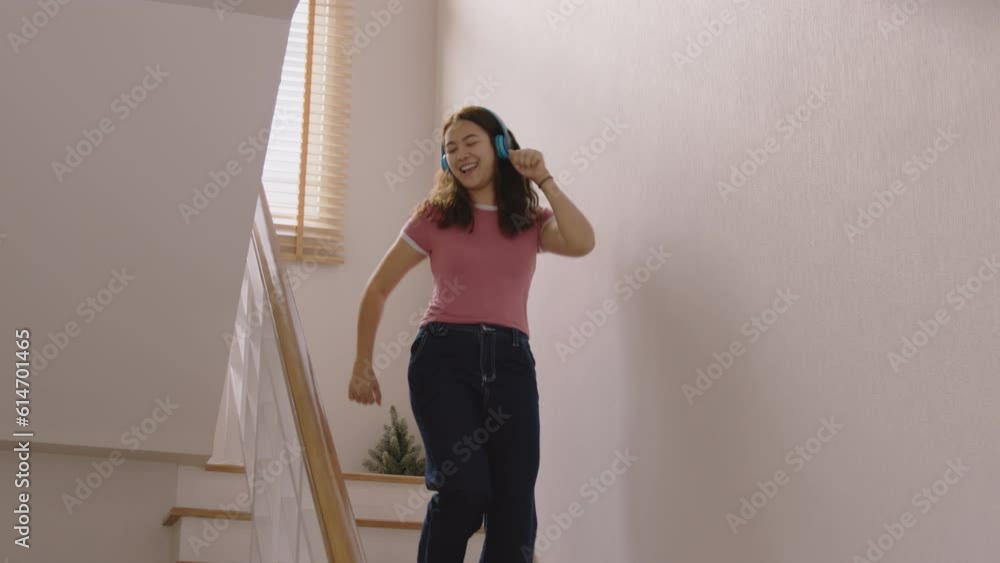 Young asia people Gen Z woman relax happy fun moving in new home. Humor laugh smile listen music funny dance crazy joy playing at staircase life balance in youth culture. Enjoy weekend staying at home Young asia people Gen Z woman relax happy fun moving in new home. Humor laugh smile listen music funny dance crazy joy playing at staircase life balance in youth culture. Enjoy weekend staying at home