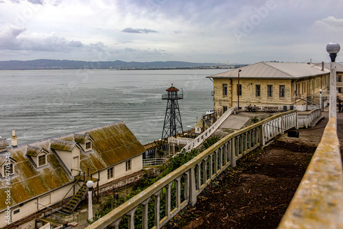 Buildings, pier and watchtower of the maximum security federal prison of Alcatraz in San Francisco Bay, in the state of California, United States of America. USA Concept. photo