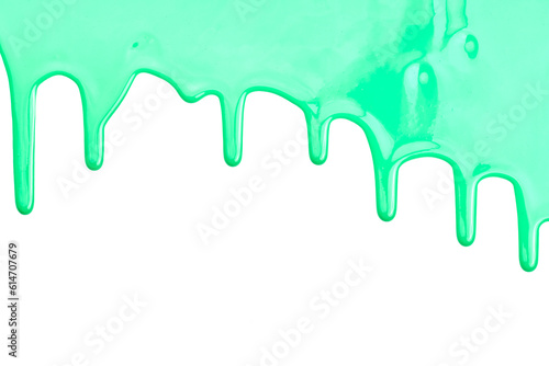 Paint drops flowing down on white paper. Green ink blots abstract background