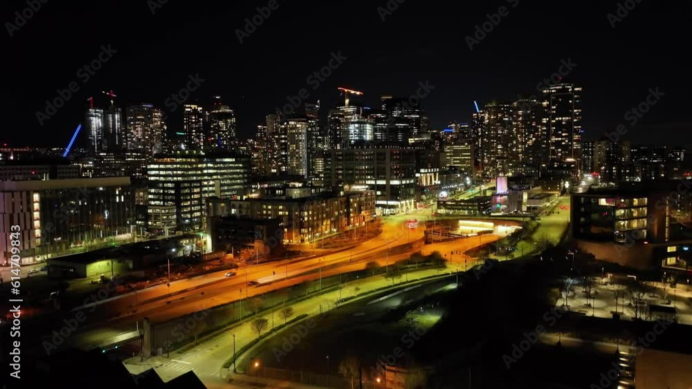 Aerial rising in Seattle Skyline, rising over city in dark night of downtown