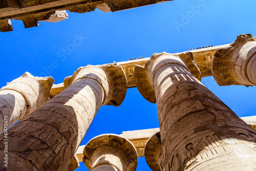 Columns in the great hypostyle hall of the Karnak temple. Looking up photo