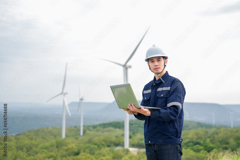 Portrait of engineer asian man working in wind turbine farm. Portrait of engineer asian man working in wind turbine farm.