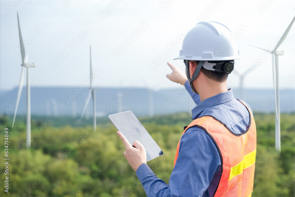 Portrait of engineer asian man working in wind turbine farm. Portrait of engineer asian man working in wind turbine farm.