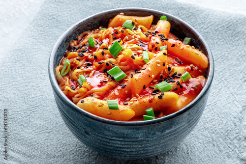 Rabokki, tteokbokki or topokki with ramen, Korean street food, spicy rice cakes in red pepper gochujang sauce, a popular dish photo