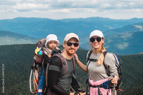 A family with a baby in the mountains