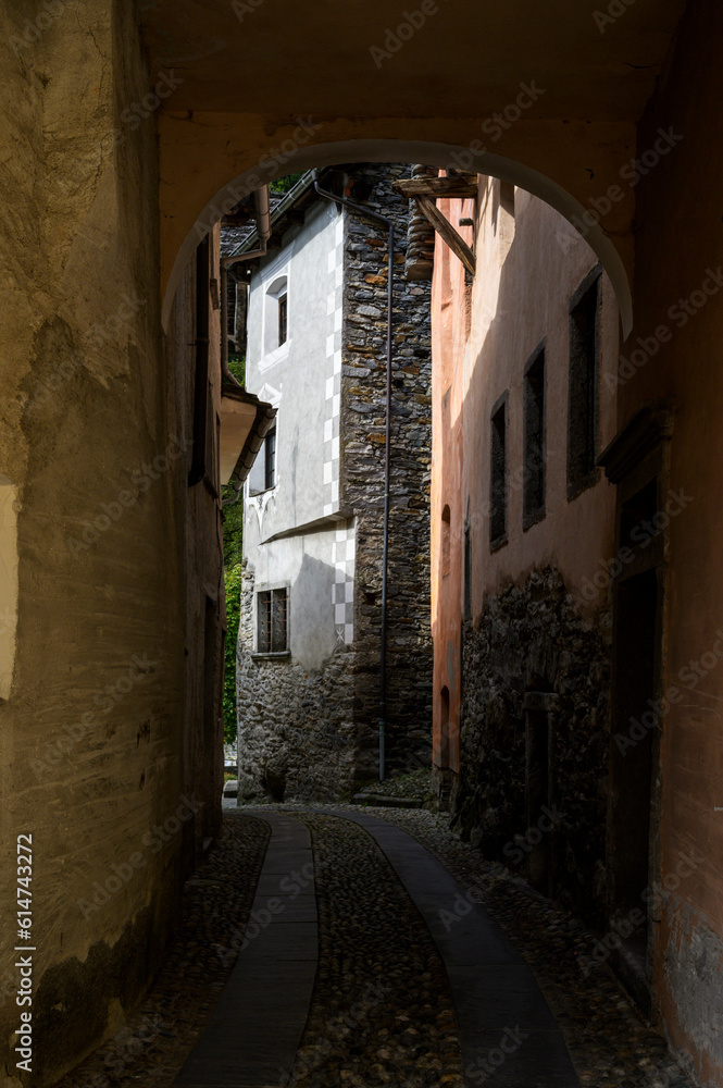 Narrow street in typical alpine village, Valle Maggia, Ticino, Switzerland.