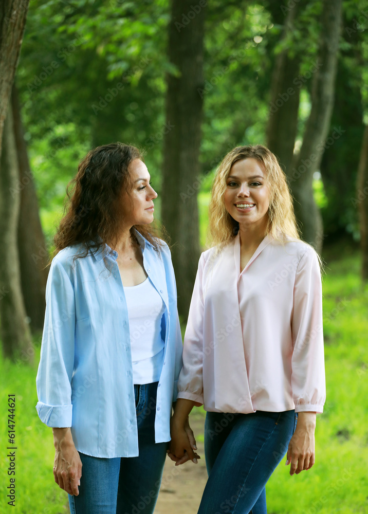 mother and daughter, spend the weekend in the park. Summer happy day. mother and daughter, spend the weekend in the park. Summer happy day.