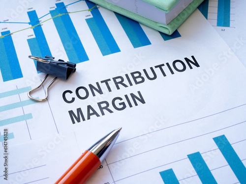 Papers with contribution margin calculation and charts.