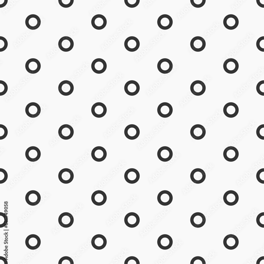 Seamless pattern of cutout circles, black and white.