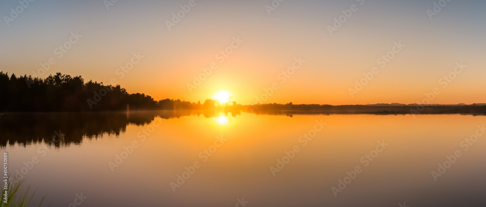 Sunset over the lake. the beautiful panorama landscape