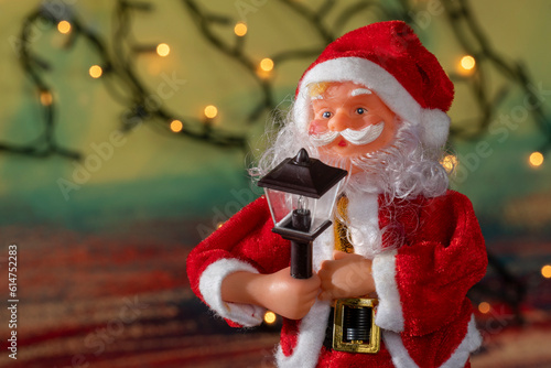 Santa Claus and Christmas puppets on abstract background with copy space