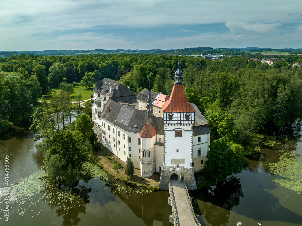 Aerial view of Blatna medieval water castle with towers,  turrets, plus extensive grounds in Bohemia