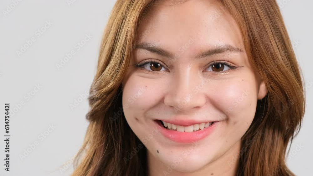 Beautiful smiling confident young woman pretty face looking at camera posing alone. happy millennial. close up front portrait Beautiful smiling confident young woman pretty face looking at camera posing alone. happy millennial. close up front portrait
