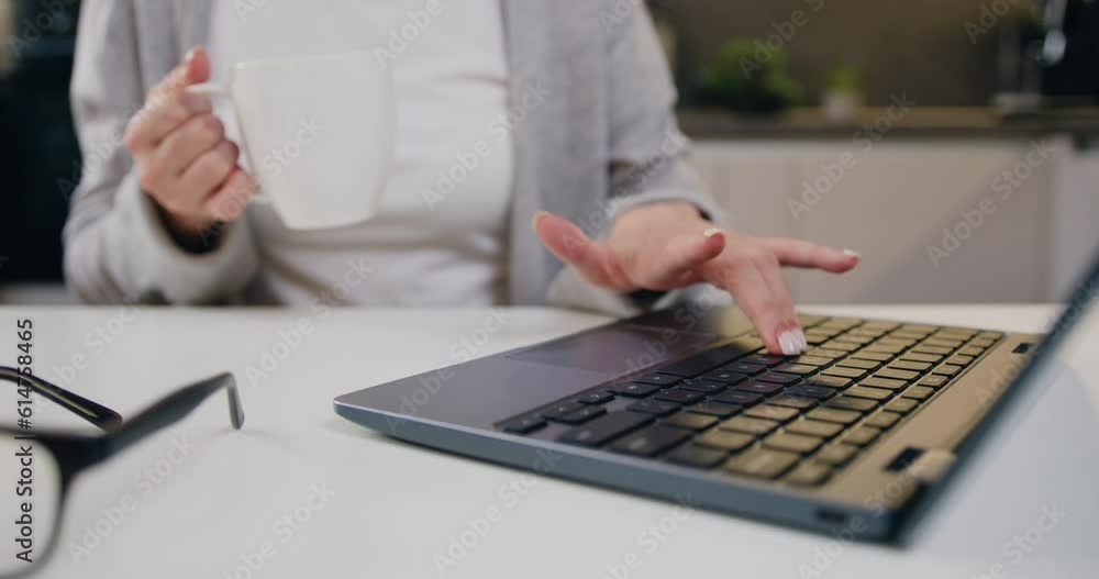 Close up of female hands typing message on laptop. Businesswoman sit at desk texting e-mail, correspond to client remotely, writes text on portable wireless pc keyboard at home officee. Close up of female hands typing message on laptop. Businesswoman sit at desk texting e-mail, correspond to client remotely, writes text on portable wireless pc keyboard at home officee.