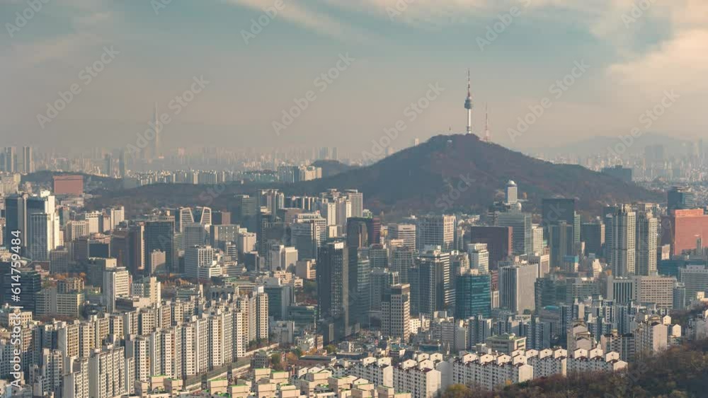 Seoul South Korea time lapse 4K, city skyline timelapse at Seoul city center view from Ansan mountain peak in autumn