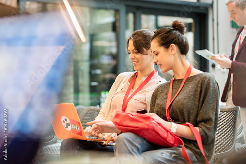 Bild auf Leinwand Female college students using laptop