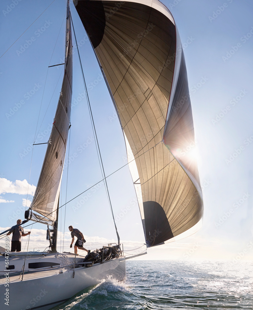 © KOTO - Wind pulling sail on sailboat on sunny ocean © KOTO - Wind pulling sail on sailboat on sunny ocean