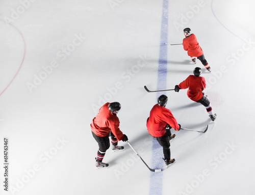 Photography Hockey team in red uniforms skating on ice