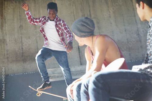 Teenage boys skateboarding at skate park