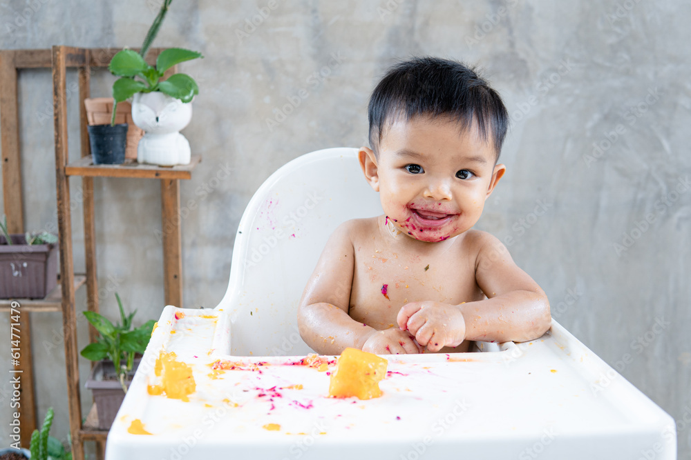 Cute little toddler child, Happy childhood and delicious food. Little cute kid eats with his hands. Funny child gets dirty with food. Cute little toddler child, Happy childhood and delicious food. Little cute kid eats with his hands. Funny child gets dirty with food.