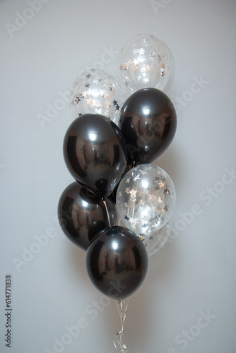 set of black balloons on a gray background
