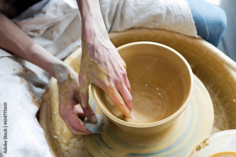 Overhead view woman using pottery wheel