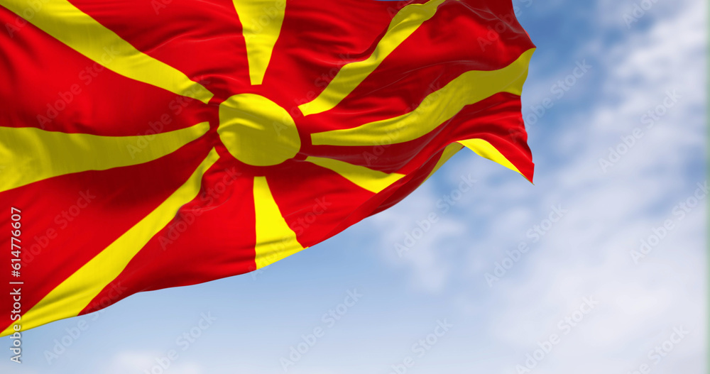 The national flag of North Macedonia that waving in the wind on a clear day