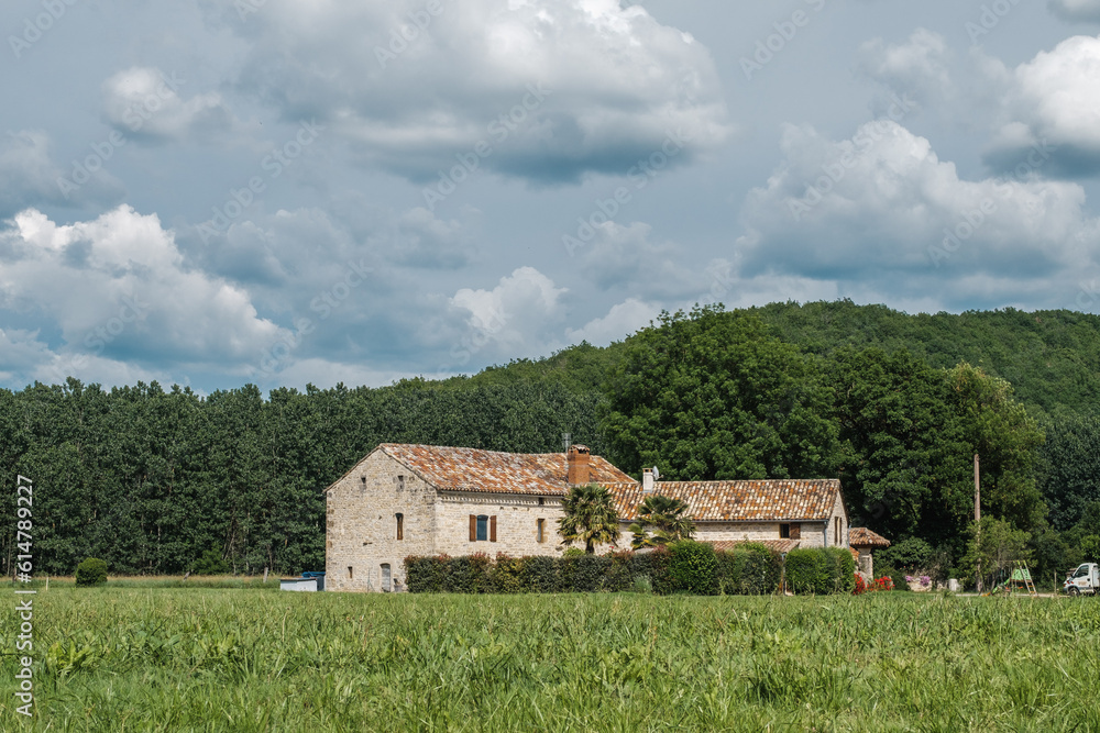 Typical rural occitan french old house, in the nature and field