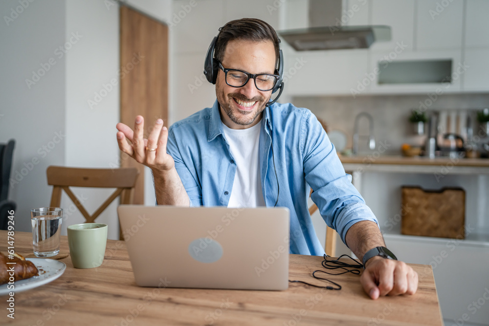 One man caucasian male freelancer work from home on laptop computer One man caucasian male freelancer work from home on laptop computer