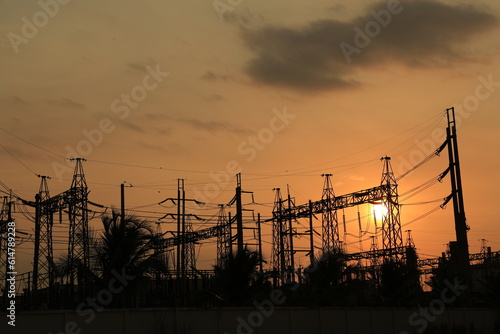 Power plant against orange light sunset with clean energy concept.