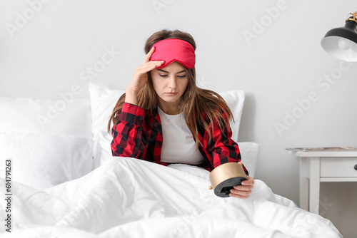 Upset young woman with alar...