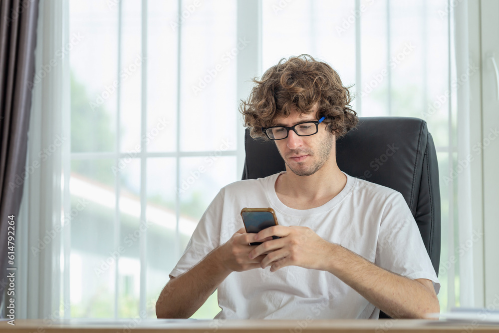 Man using mobile smartphone, Casual man sitting relaxed in the room
