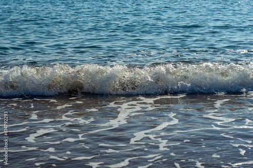 Sea waves on a sand beach