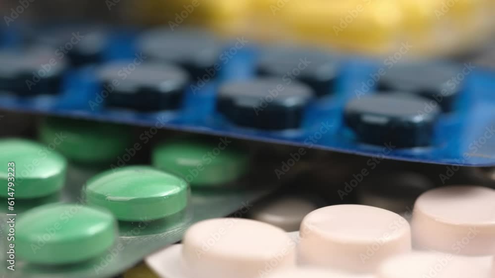close up with rotating pills and medicines with blister packaging. concept of medicine, pharmacy, healthcare, pharmaceutical industry. close up with rotating pills and medicines with blister packaging. concept of medicine, pharmacy, healthcare, pharmaceutical industry.