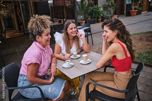 friends having coffee on an outdoor terrace