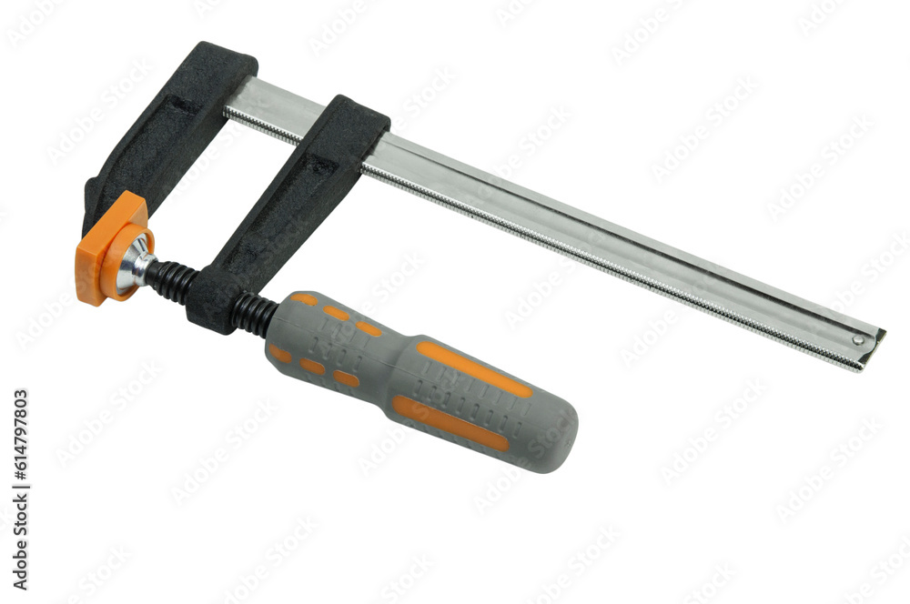 metal adjustable clamp on a white background. industrial powerful clamp on the table. wood gluing concept. fixing device on a work texture metal adjustable clamp on a white background. industrial powerful clamp on the table. wood gluing concept. fixing device on a work texture