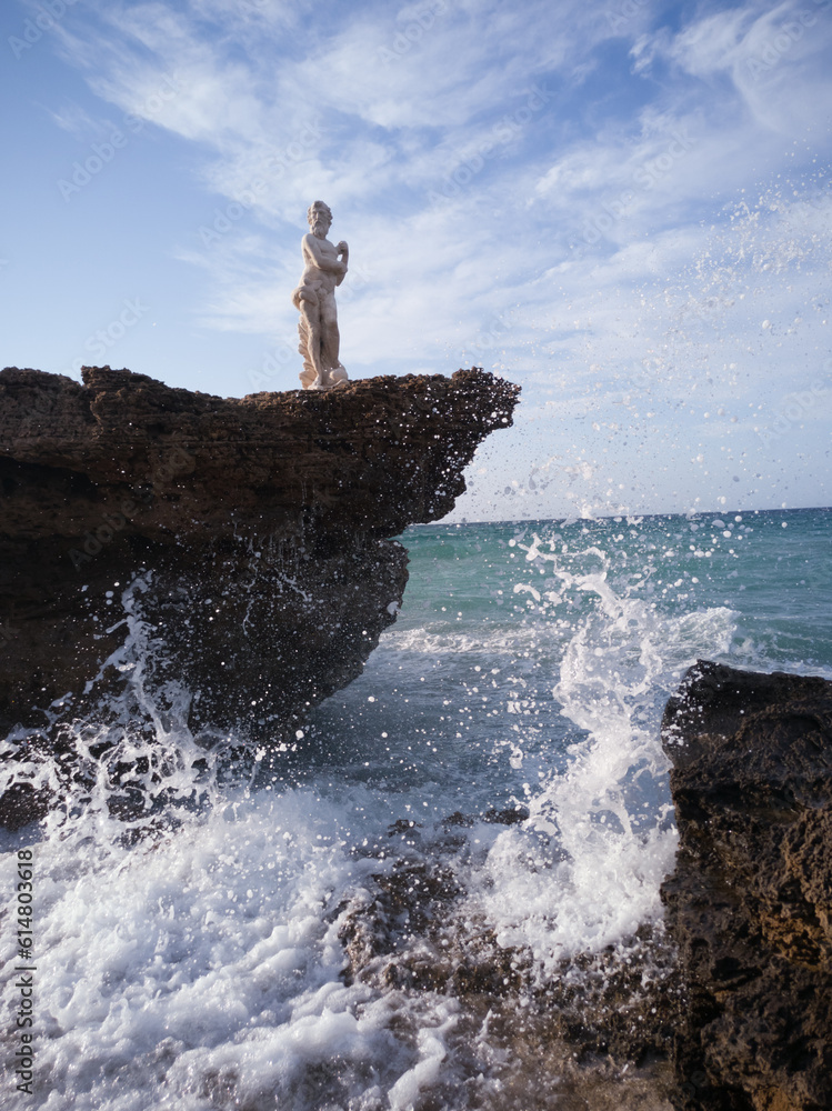 statue on the rocks